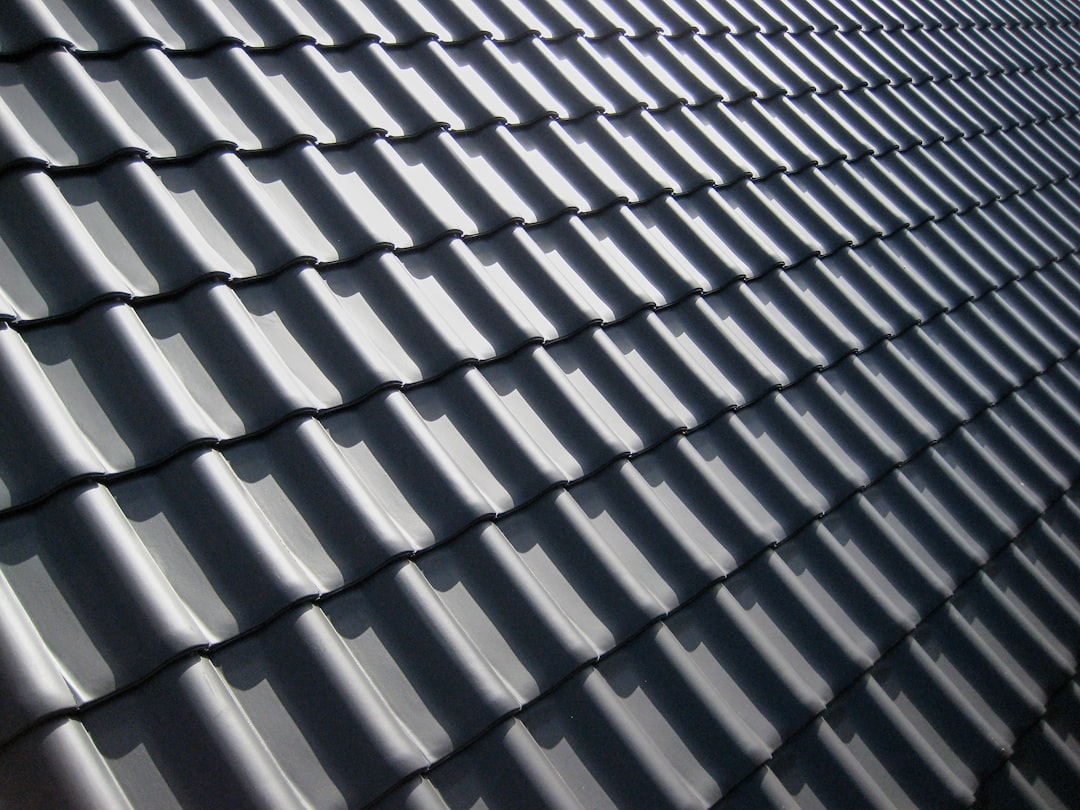 Finished grey tiled roof after a full re-roof